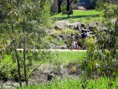 Family cycling at Merri Creek path